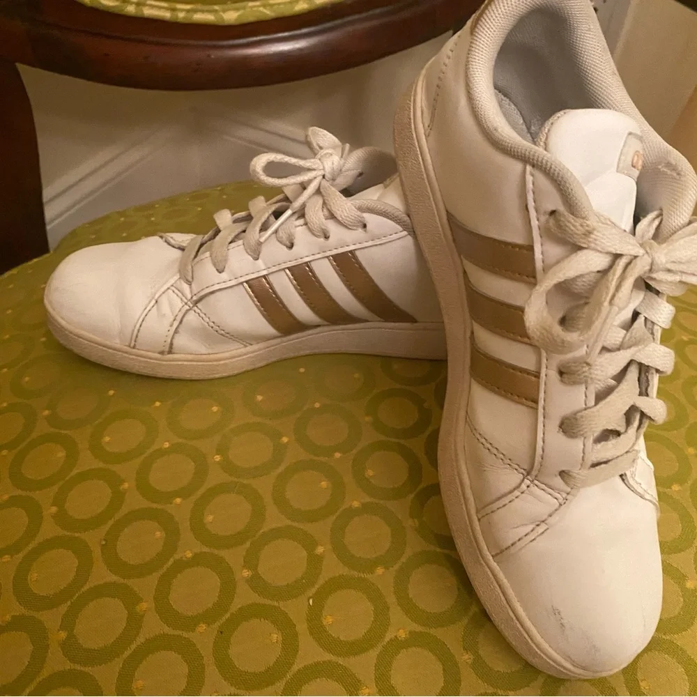 Adidas White and gold sneakers.